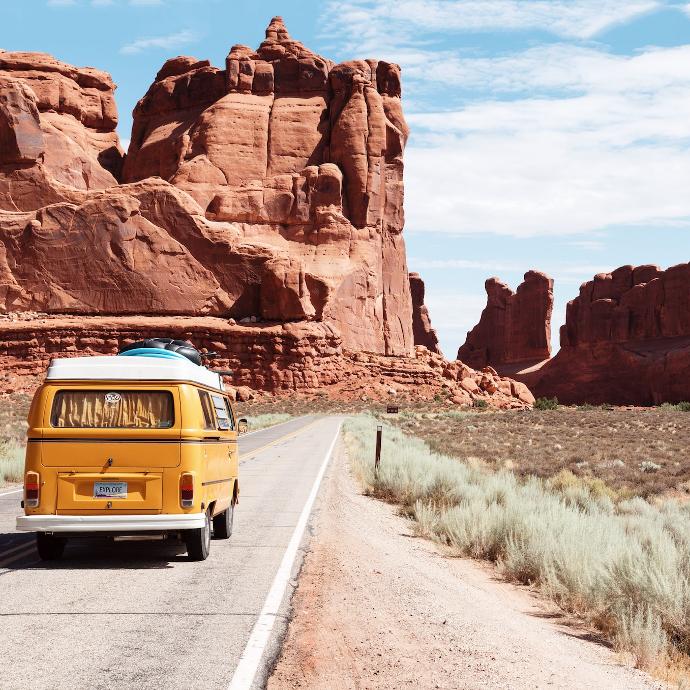 yellow Volkswagen van on road