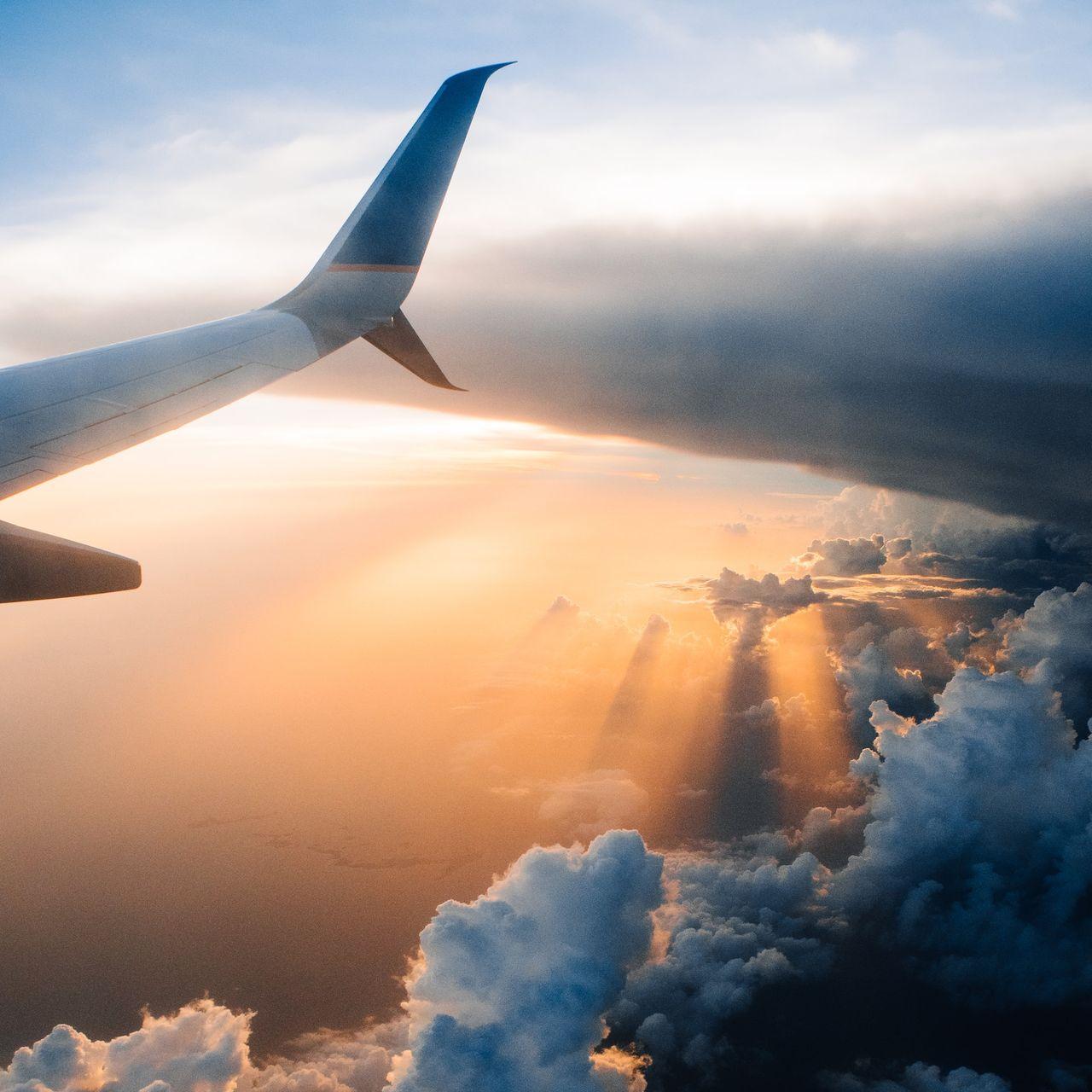 airplane on sky during golden hour